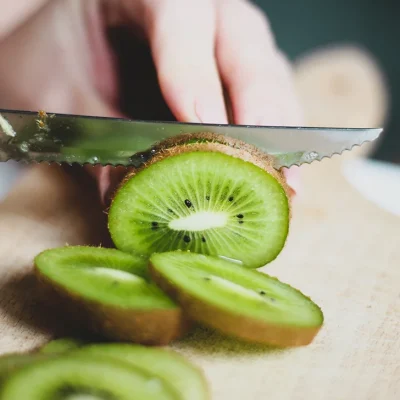 female-cutting-kiwi-1296-728-header